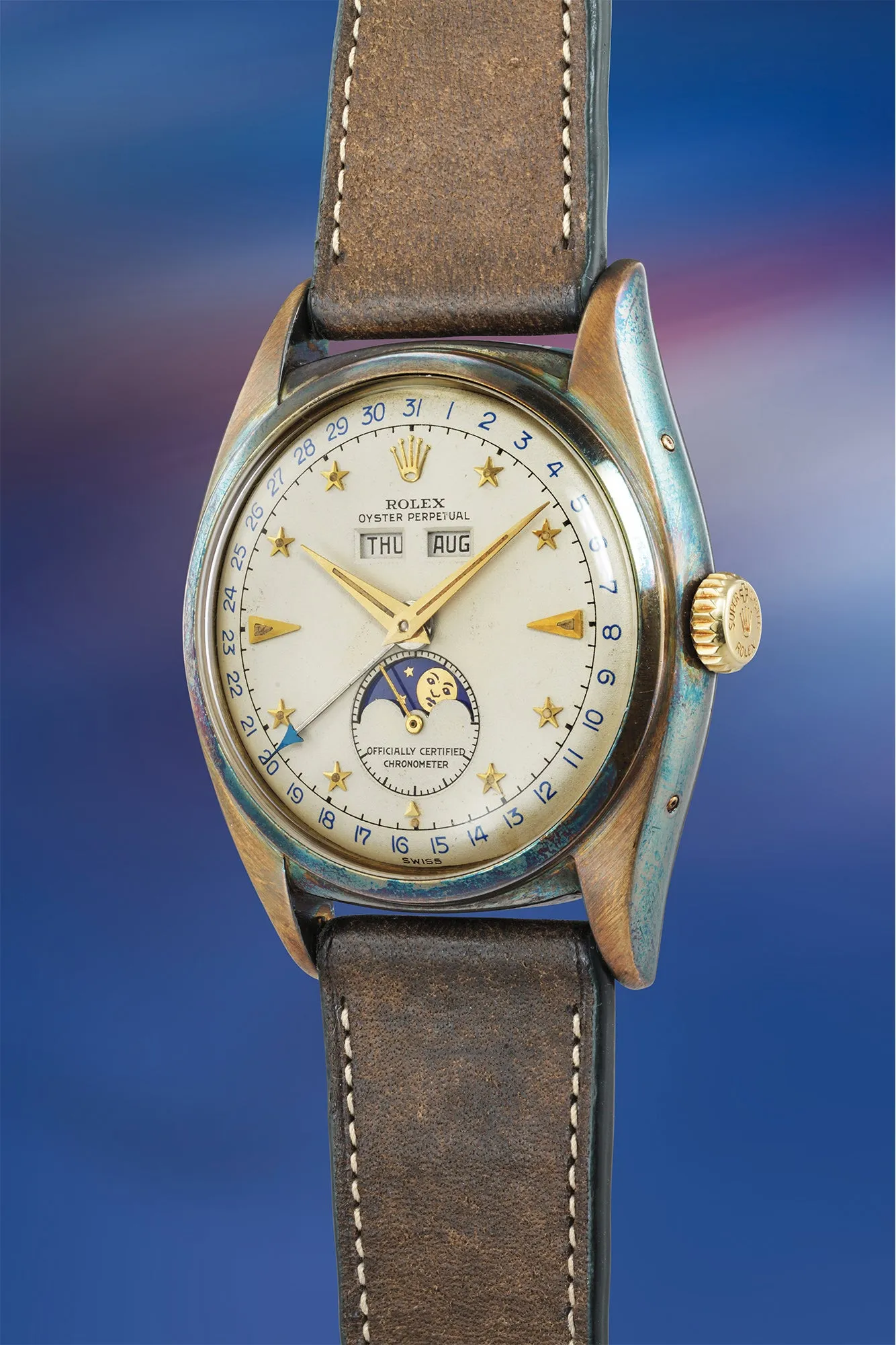 Rolex référence 6062 « Stelline » en or jaune, triple quantième et phase de lune, index en forme d'étoiles